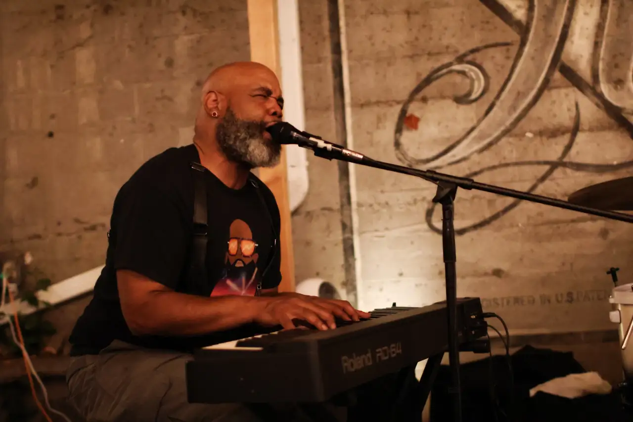 Singing at a Roland keyboard in a SWADE crystal-art T-shirt